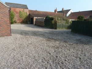20 tonnes of gravel on communal parking area