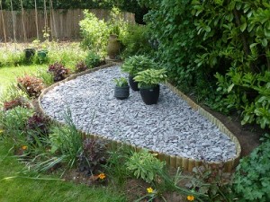 New raised bed made with log rolls and plum slate